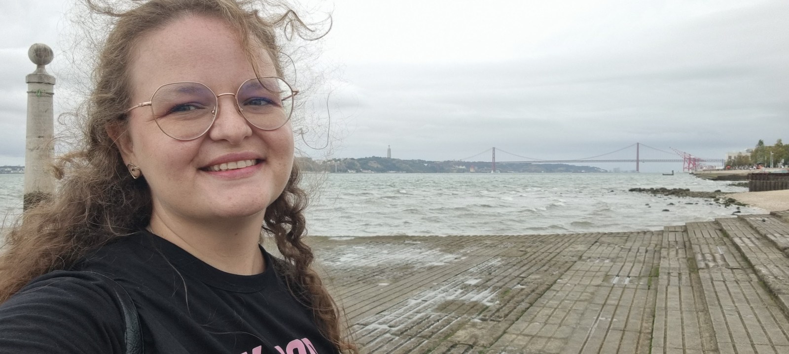 Abilene smiling beside the waterfront